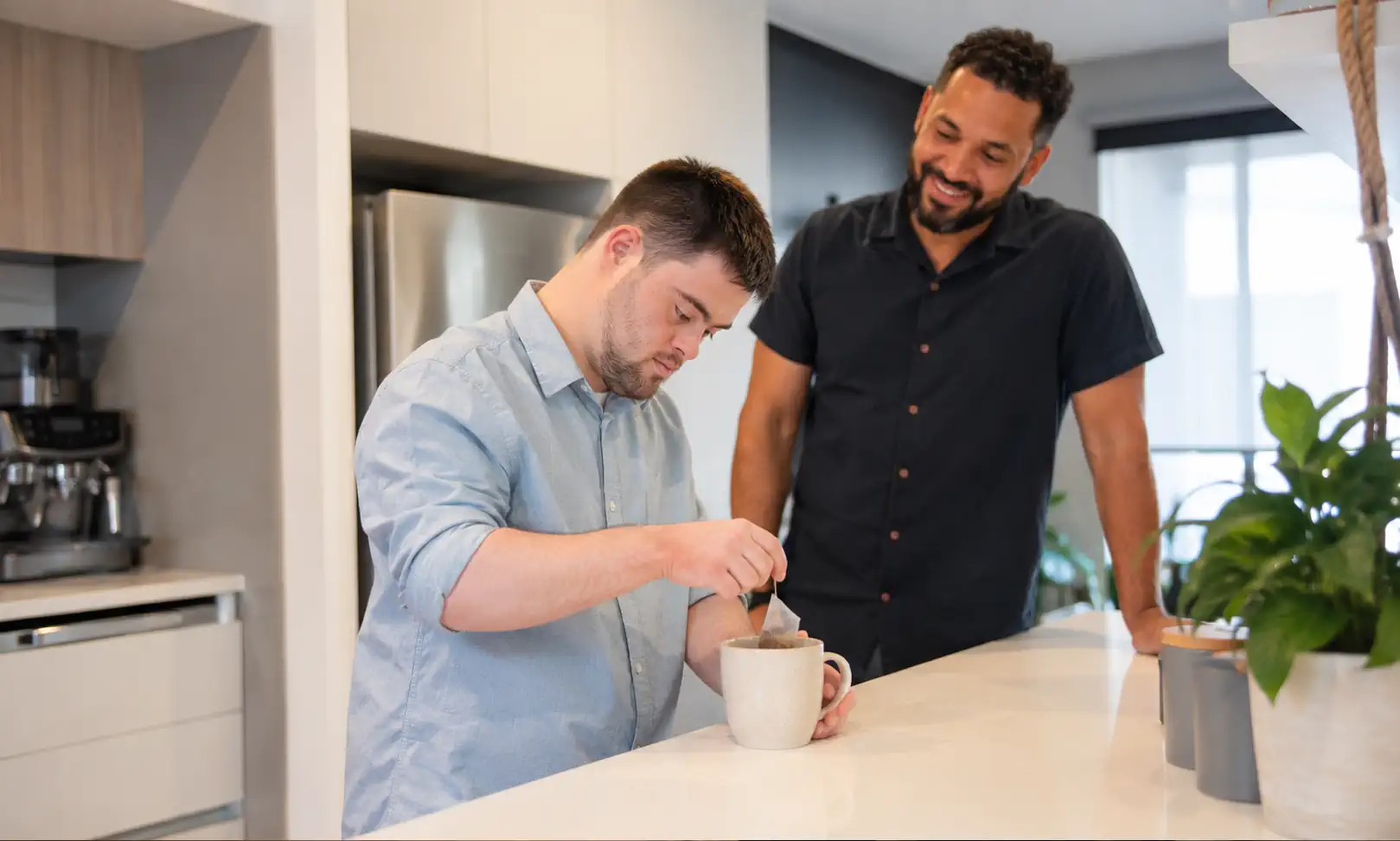 NDIS participant receiving Supported Independent Living (SIL) accommodation support in a Melbourne home while developing daily living skills.